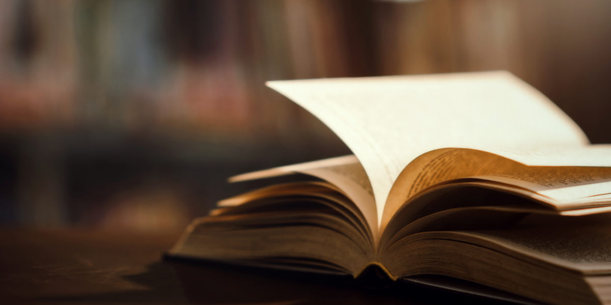 Book in library with open textbook,education learning concept versek, könyv